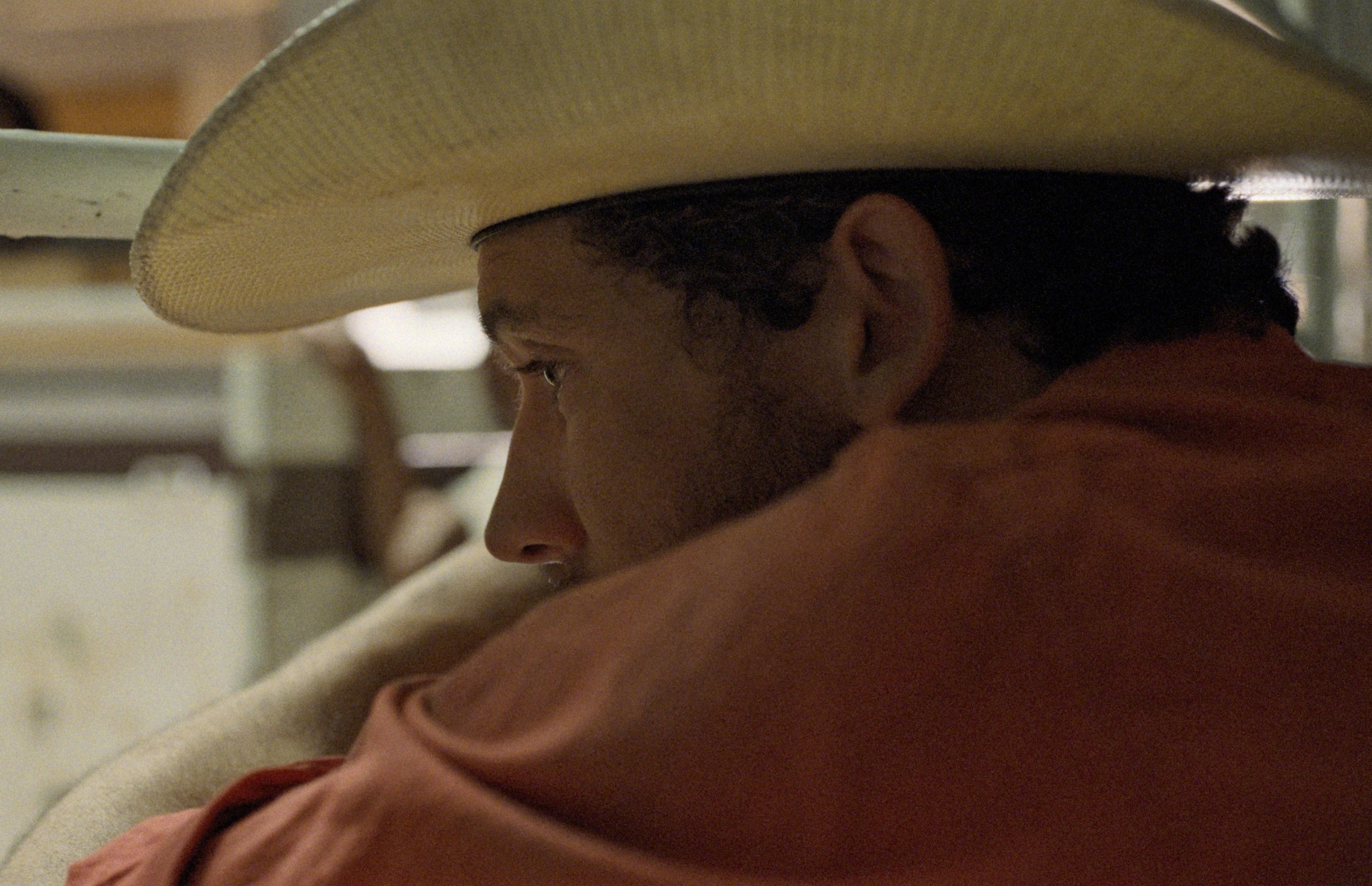 Rebuilding — a man in a cowboy hat embracing someone