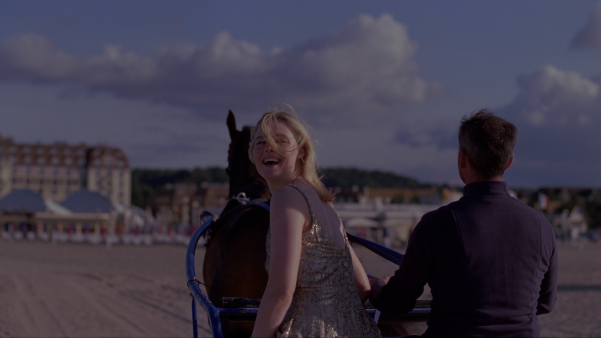 Sentimental Value – EPK — a woman looking back from a horse-drawn carriage